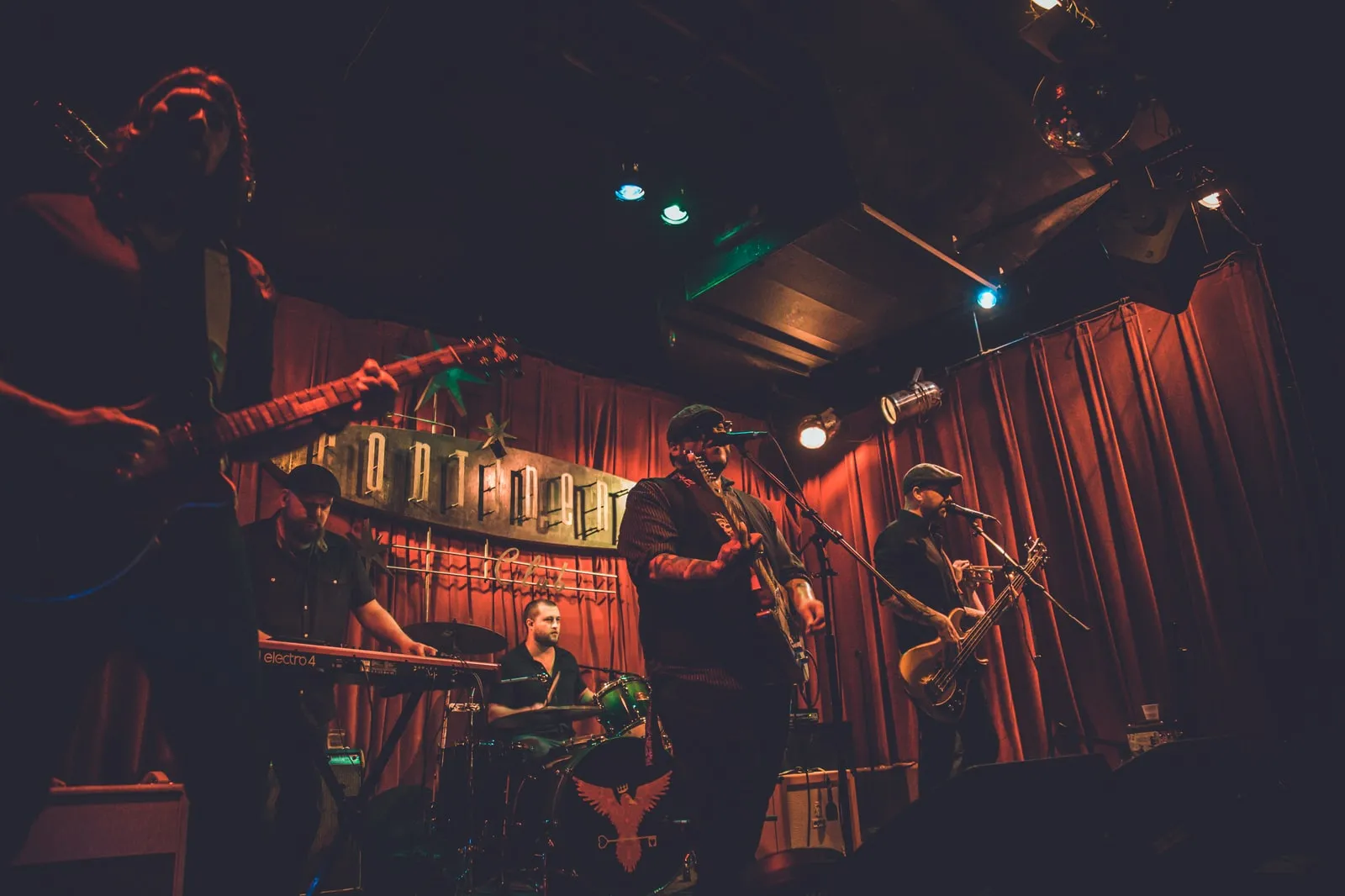 Heart of the City under red curtains and the Continental Club sign, a Nord Electro at the left of the stage.