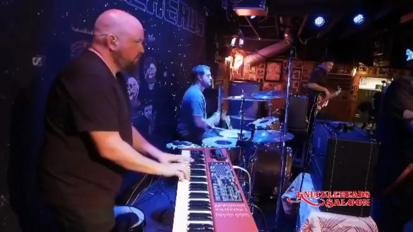 Playing keys on a club stage during the 2017 tour.